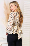 Printed Tied Plunge Peplum Blouse